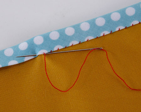 Bias binding whip stitched into place with very small stitches